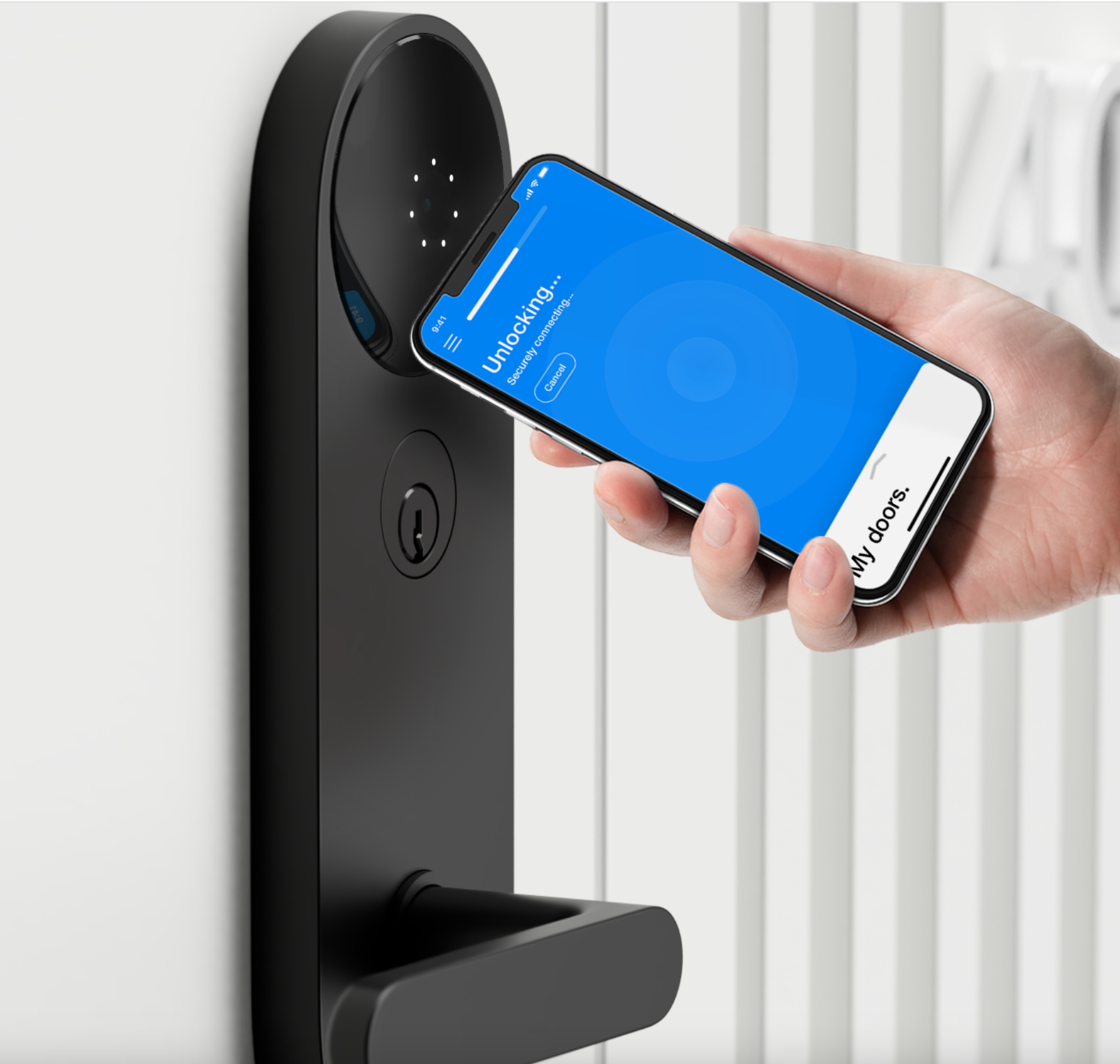 A phone held near the black Latch reader while the app connects